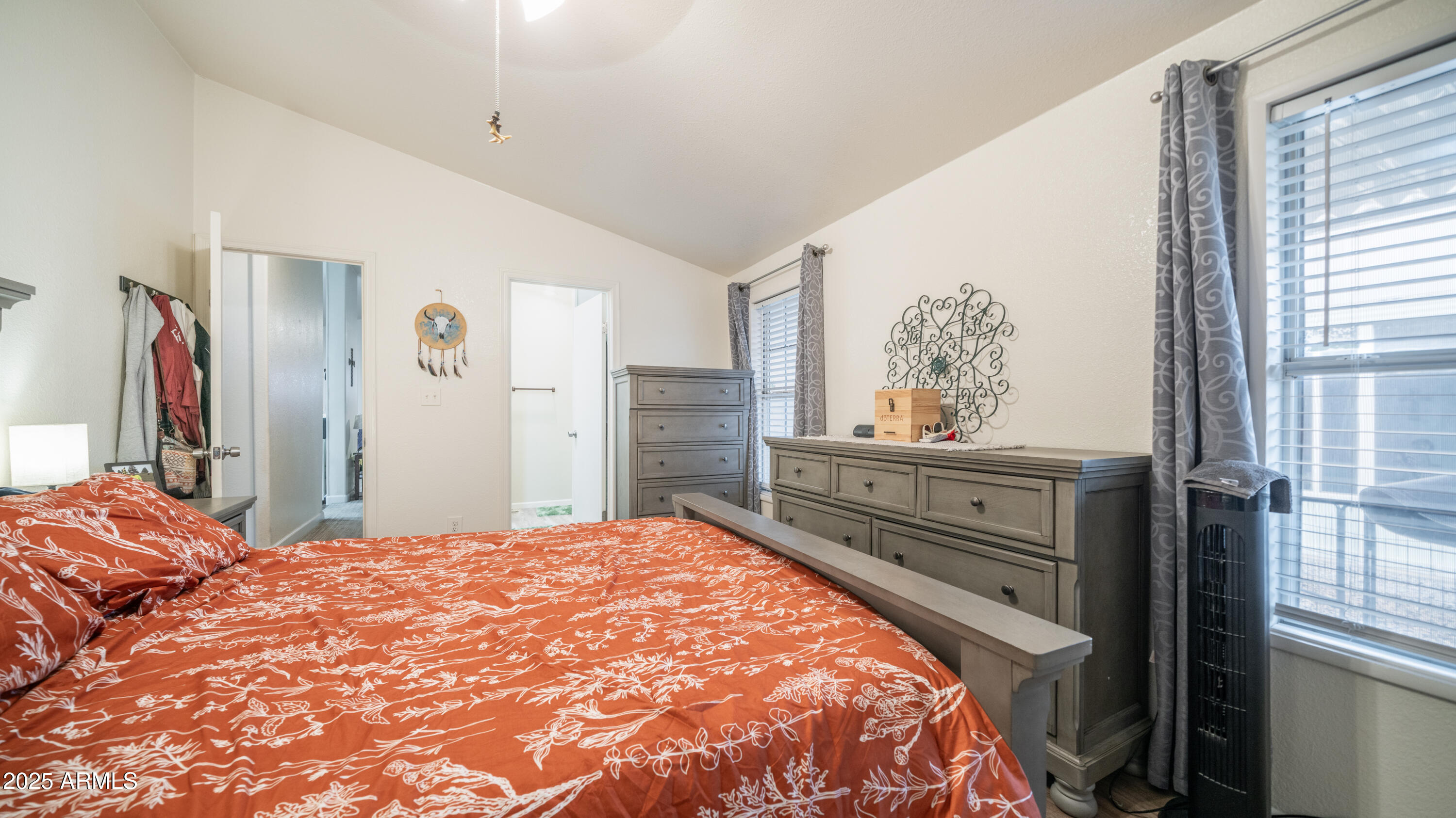 3355 South Cortez Road, Unit 98 Apache Junction, AZ 85119 - Photo 24 of 46 a bedroom with a bed and a window