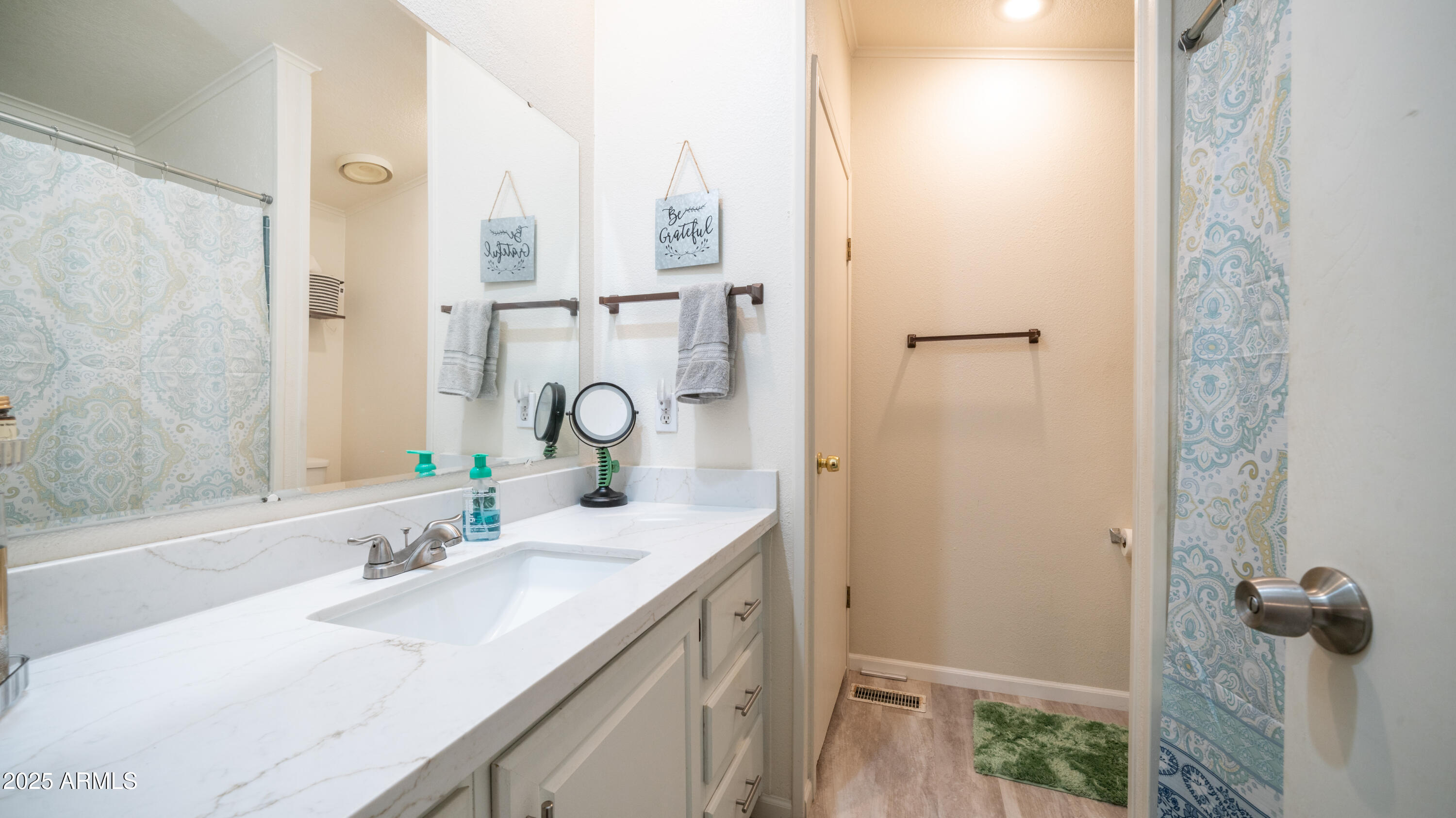 3355 South Cortez Road, Unit 98 Apache Junction, AZ 85119 - Photo 25 of 46 a bathroom with a sink and a mirror