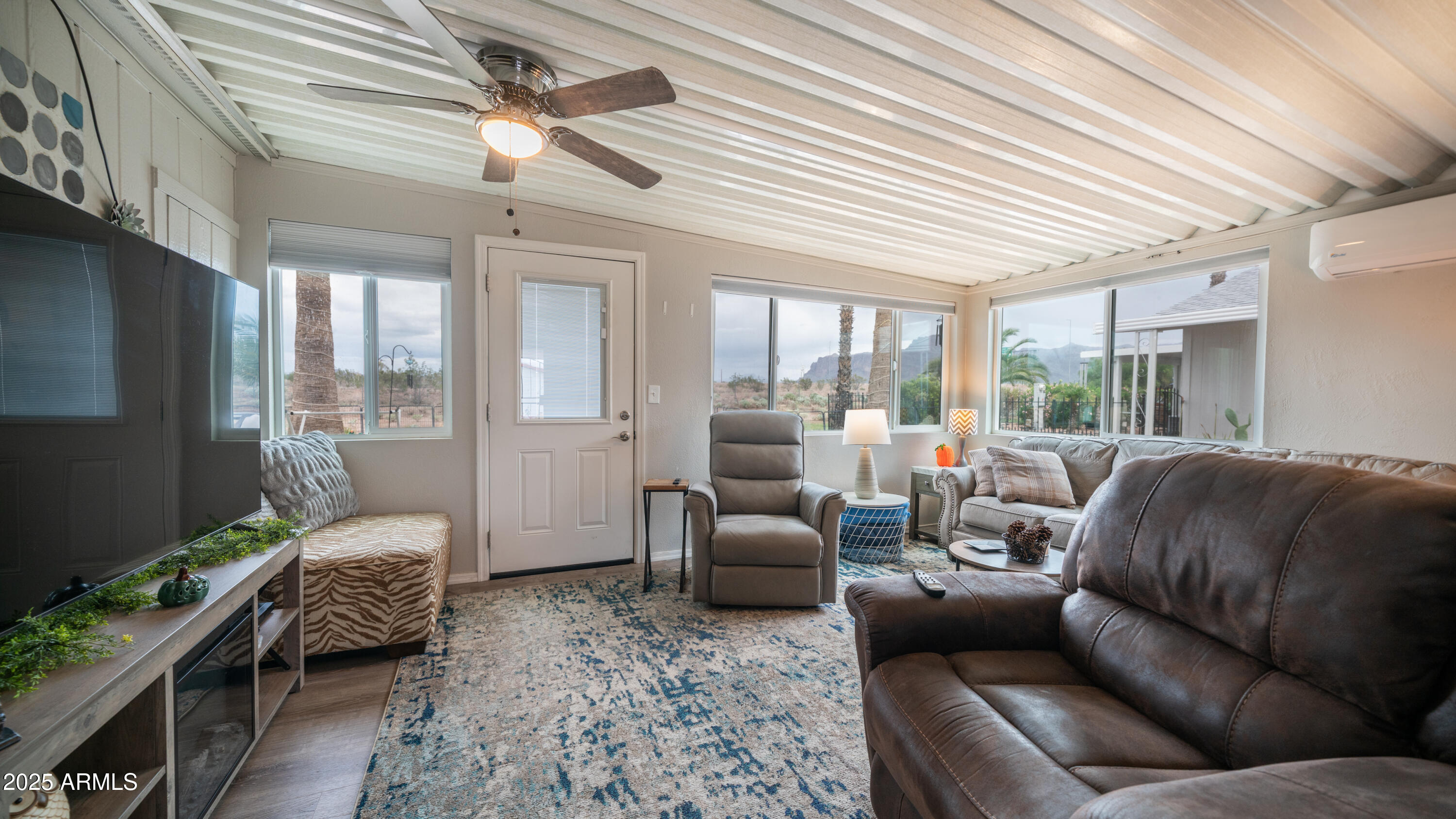 3355 South Cortez Road, Unit 98 Apache Junction, AZ 85119 - Photo 30 of 46 a living room with furniture and a large window