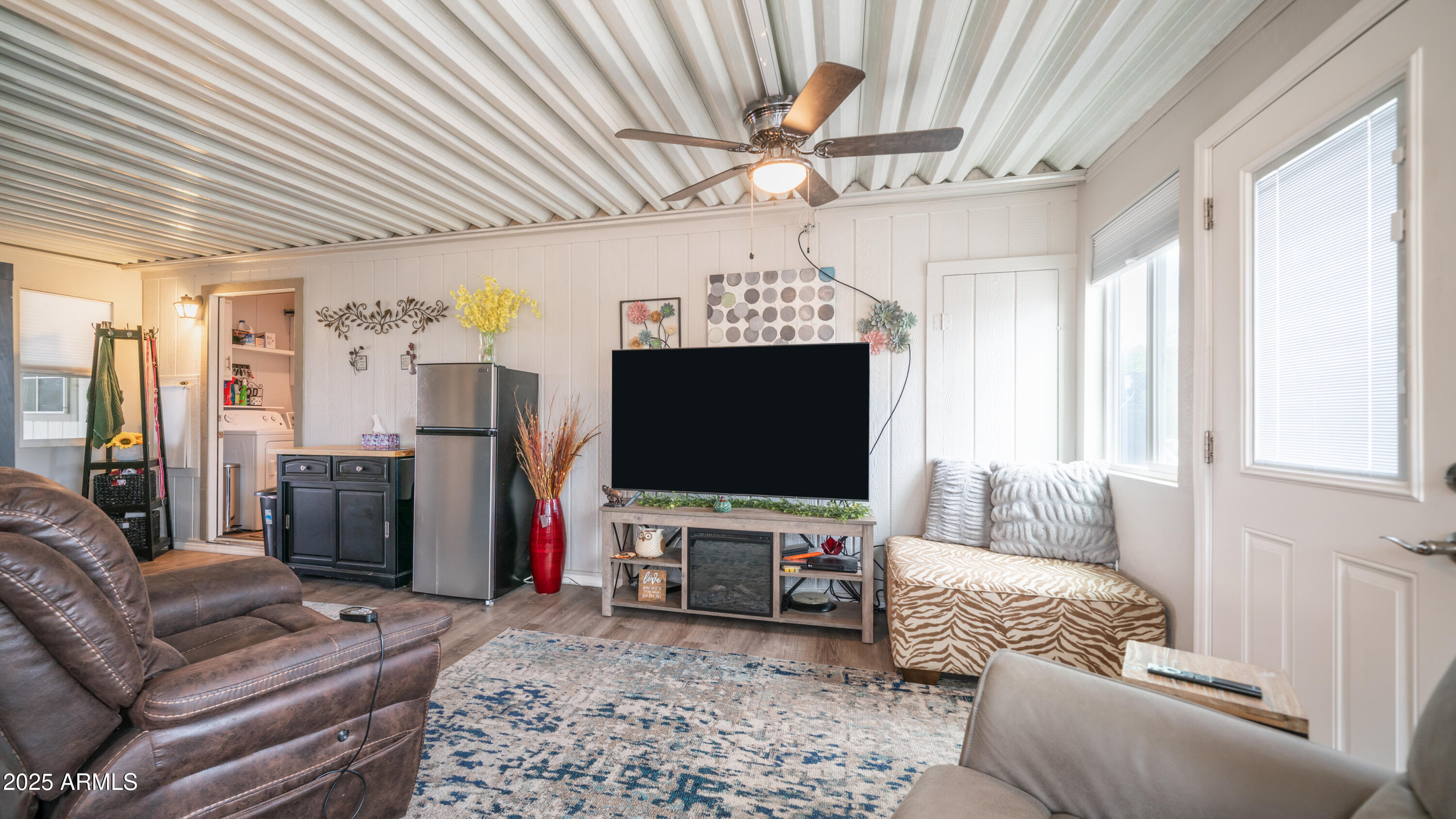3355 South Cortez Road, Unit 98 Apache Junction, AZ 85119 - Photo 33 of 46 a living room with furniture and a flat screen tv