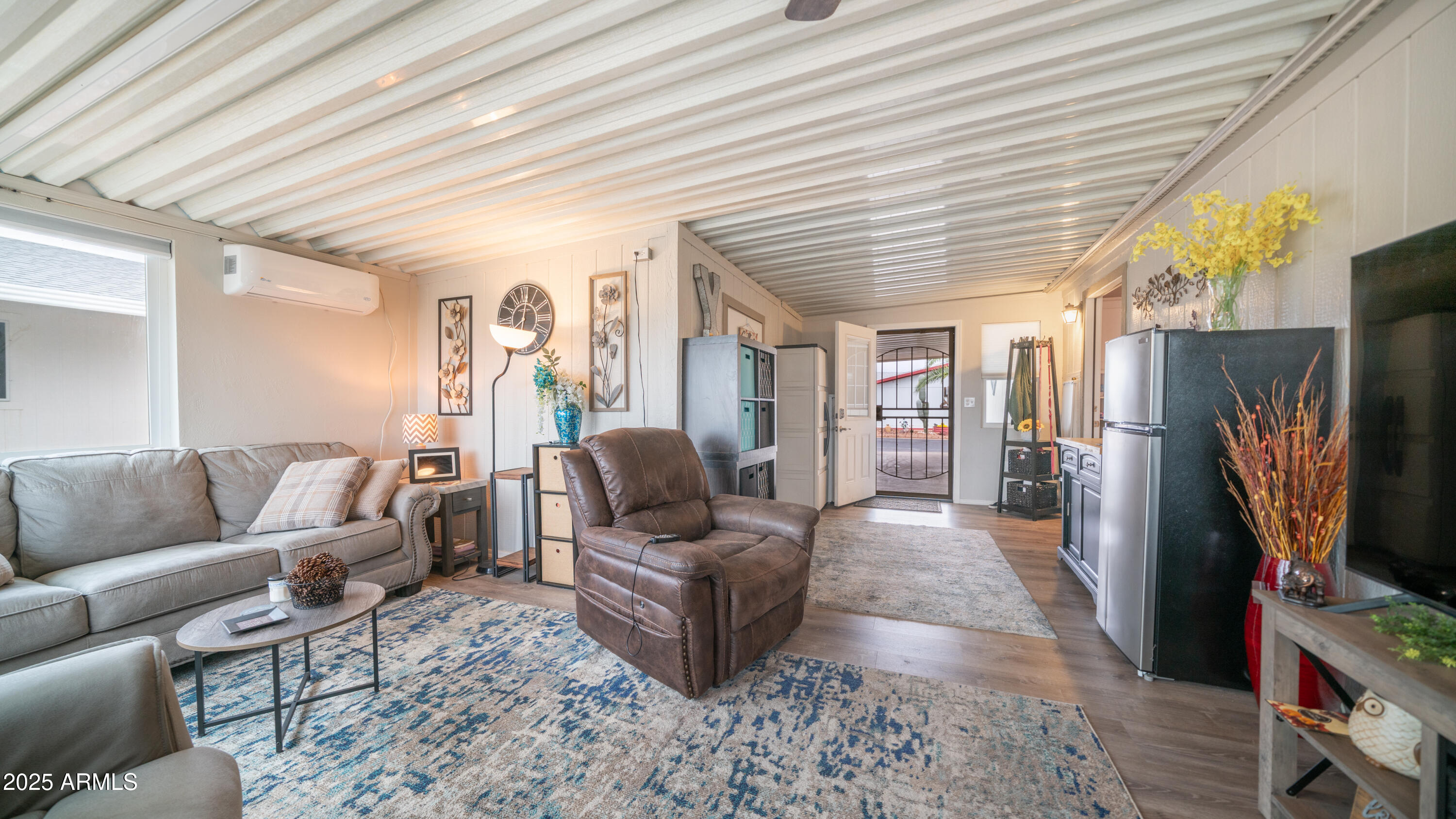 3355 South Cortez Road, Unit 98 Apache Junction, AZ 85119 - Photo 34 of 46 a living room with furniture and a flat screen tv