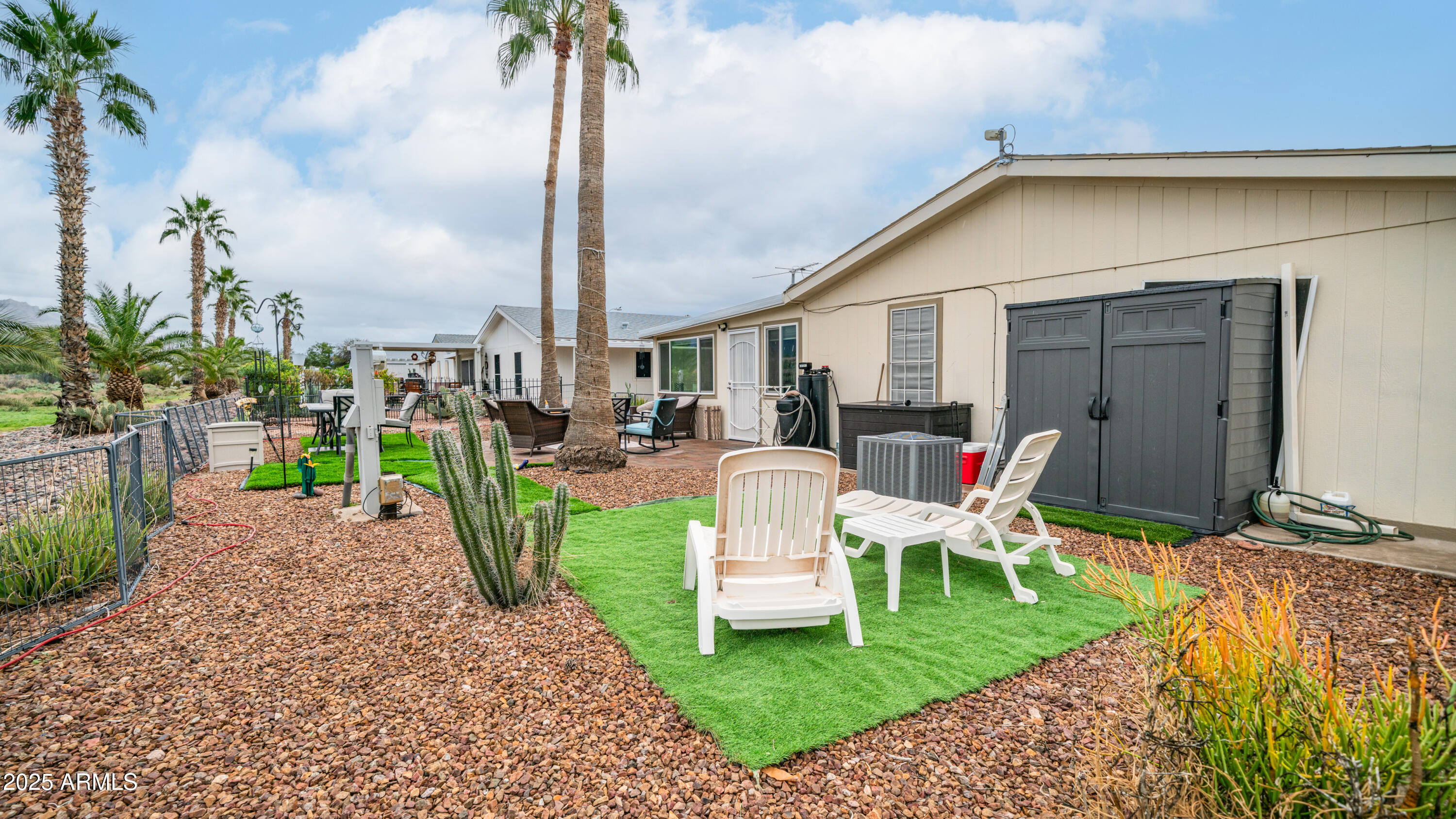 3355 South Cortez Road, Unit 98 Apache Junction, AZ 85119 - Photo 38 of 46 a view of a chair and table in backyard of the house