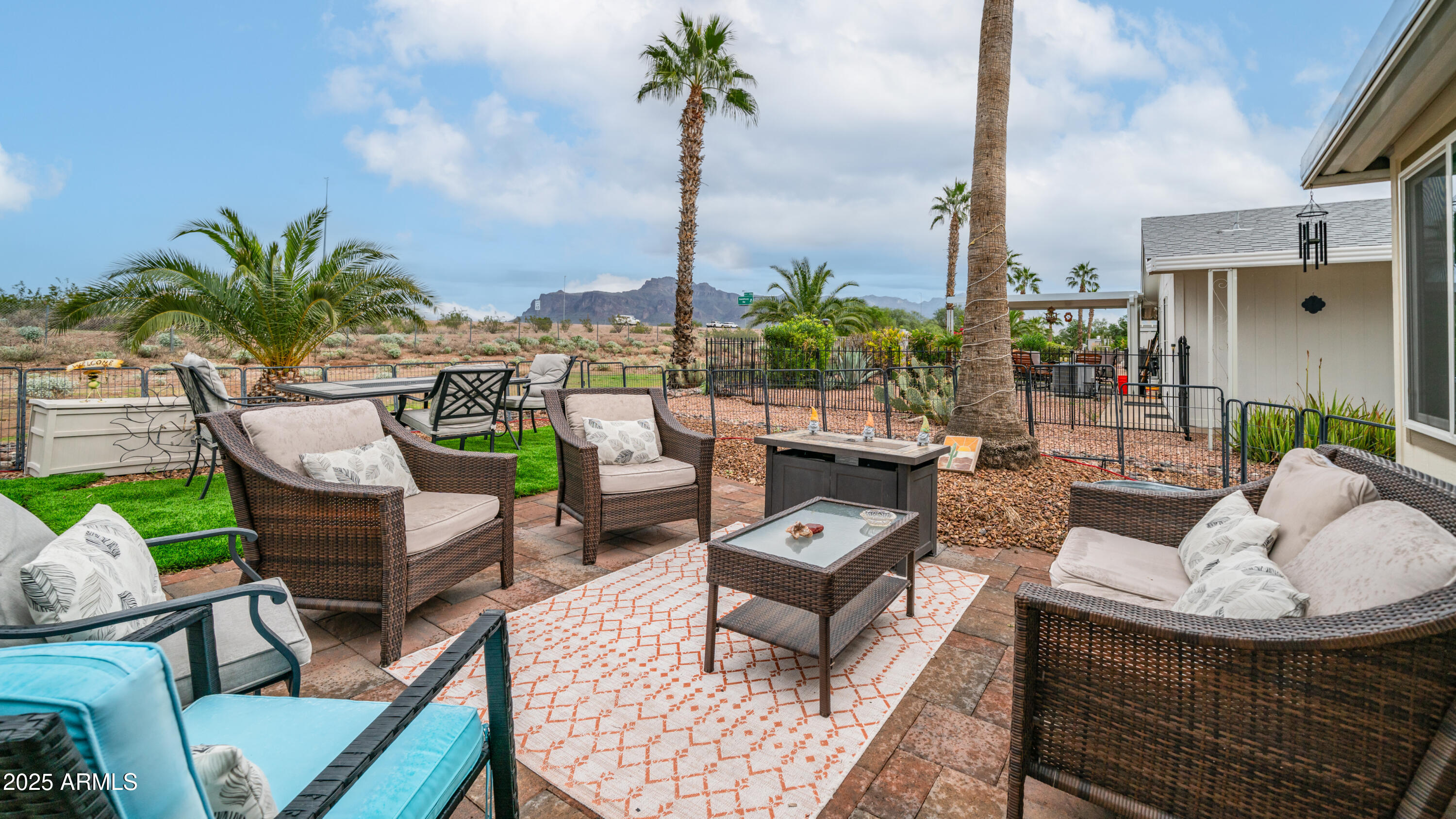 3355 South Cortez Road, Unit 98 Apache Junction, AZ 85119 - Photo 39 of 46 a outdoor living space with furniture potted plant and a large window