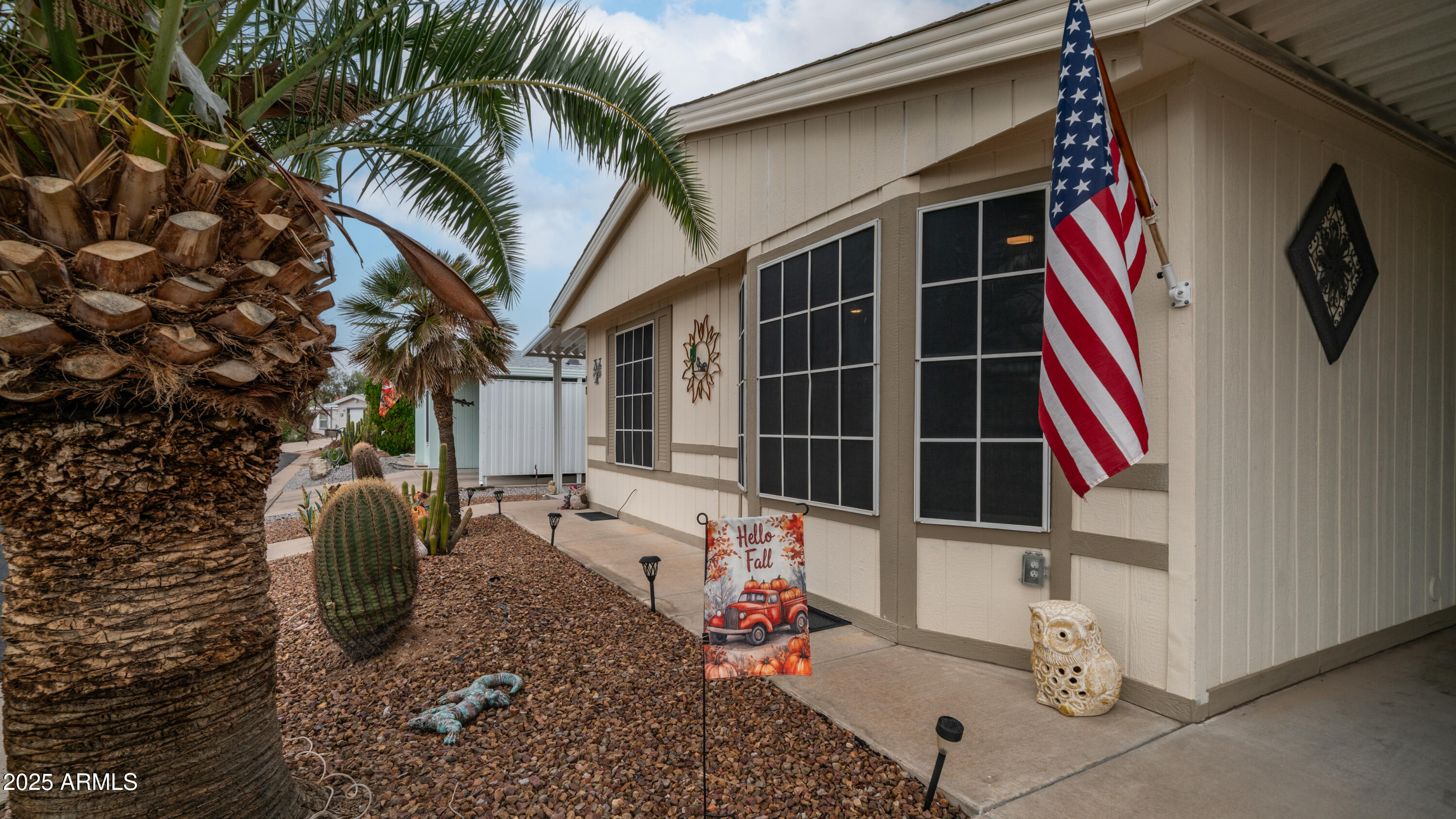 3355 South Cortez Road, Unit 98 Apache Junction, AZ 85119 - Photo 6 of 46 a backyard of a house with seating space