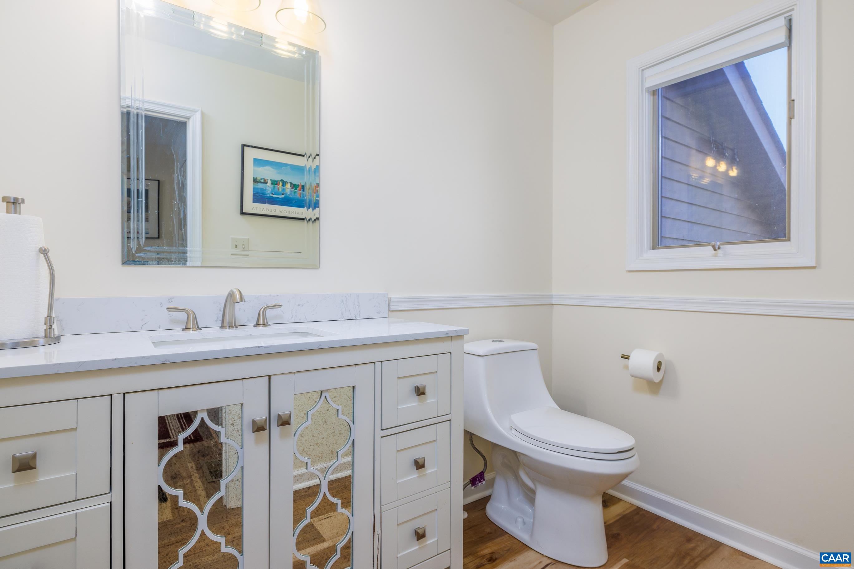 B3 Marina Point Palmyra, VA 22963 - Photo 21 of 47 a bathroom with a toilet a sink and mirror
