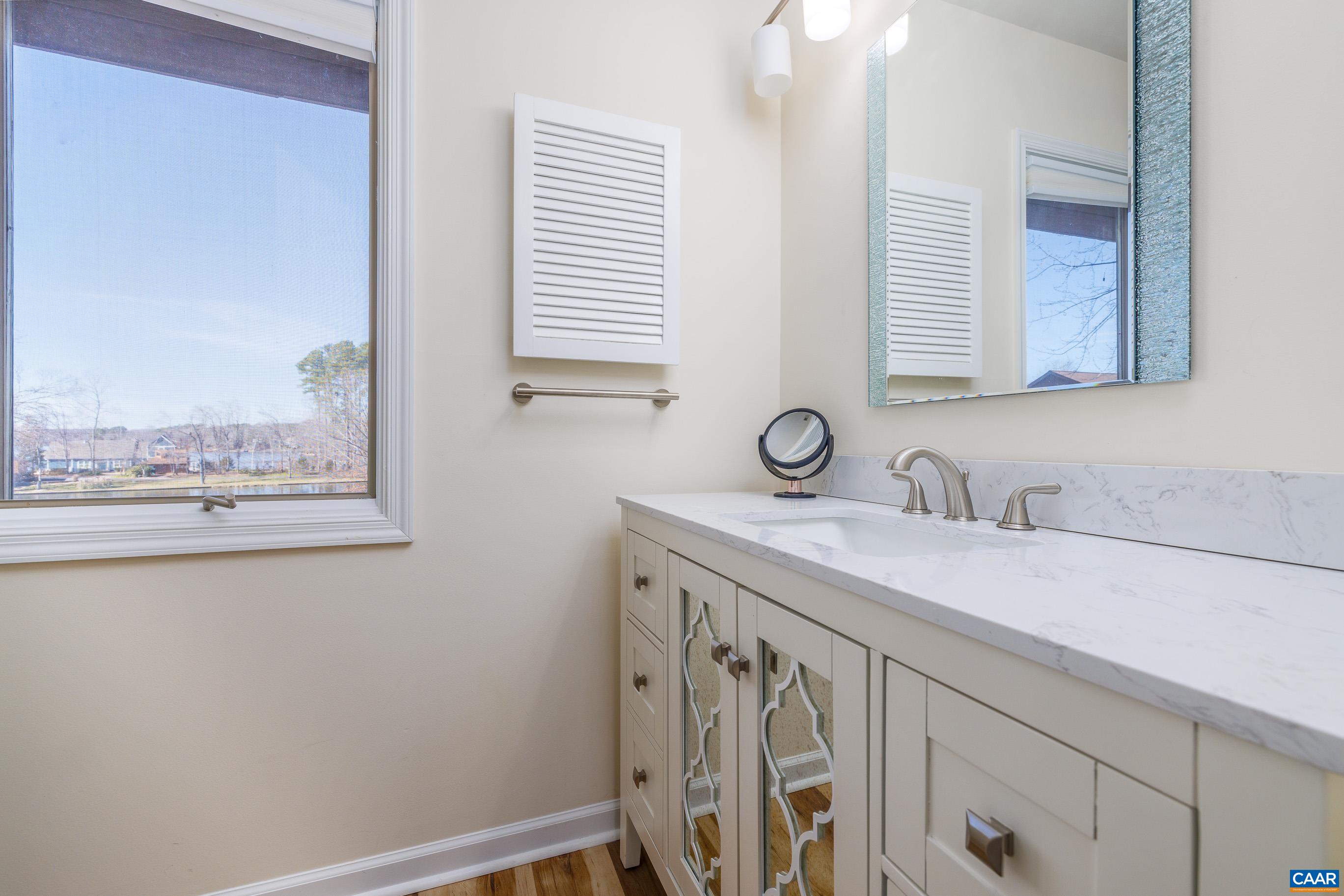 B3 Marina Point Palmyra, VA 22963 - Photo 24 of 47 a bathroom with a sink and a mirror