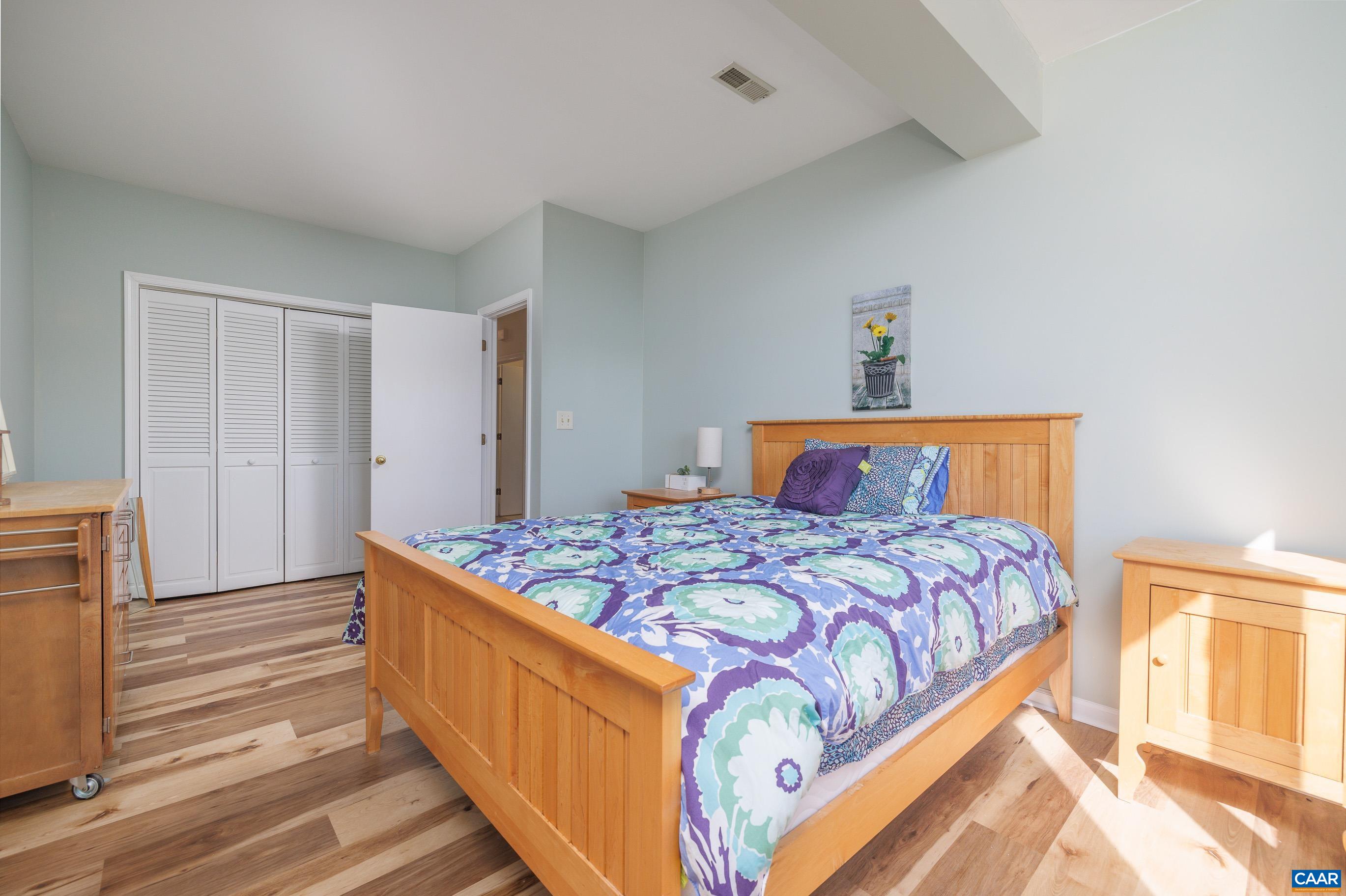 B3 Marina Point Palmyra, VA 22963 - Photo 27 of 47 a bedroom with bed and wooden floor