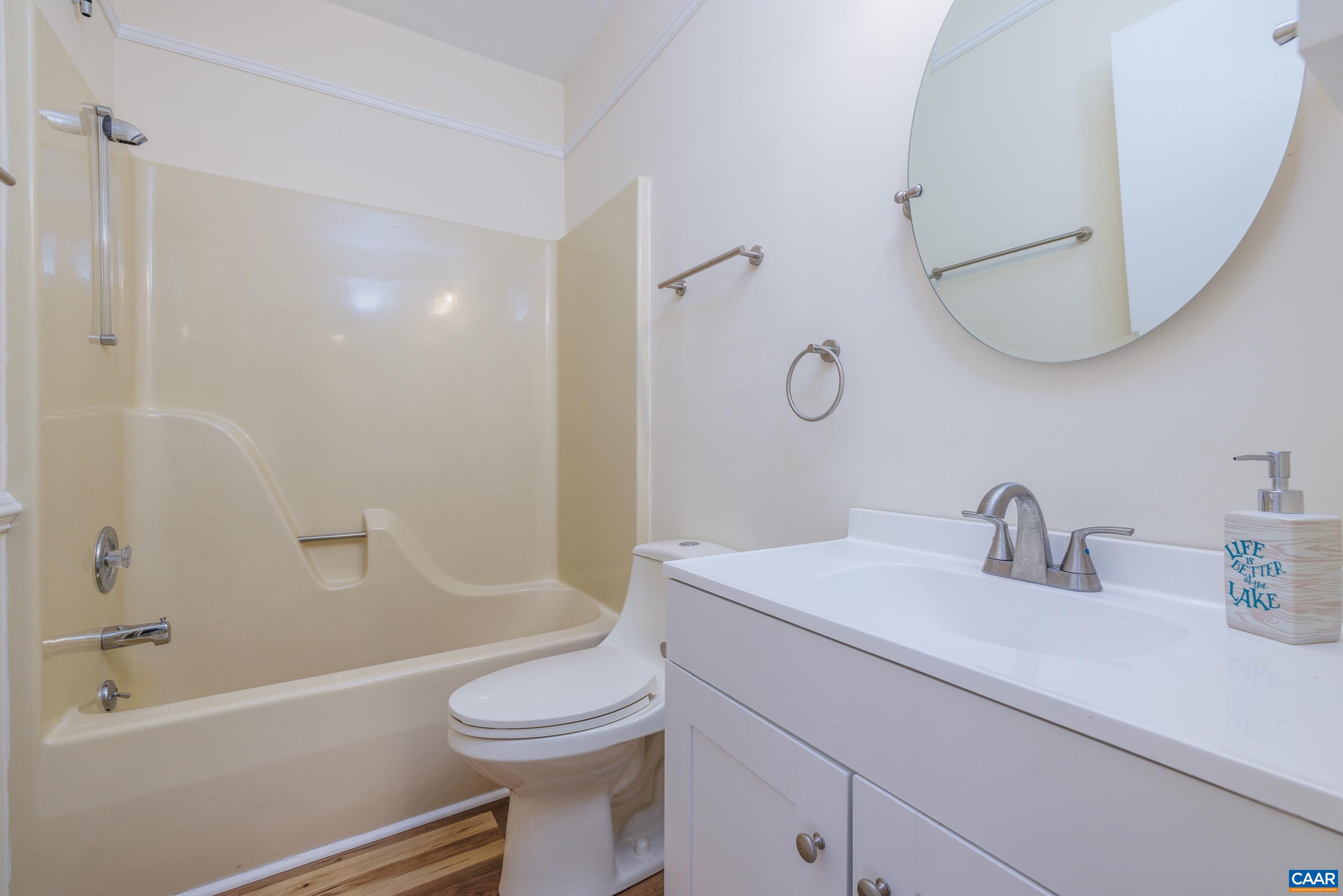 B3 Marina Point Palmyra, VA 22963 - Photo 28 of 47 a bathroom with a sink a toilet and a mirror