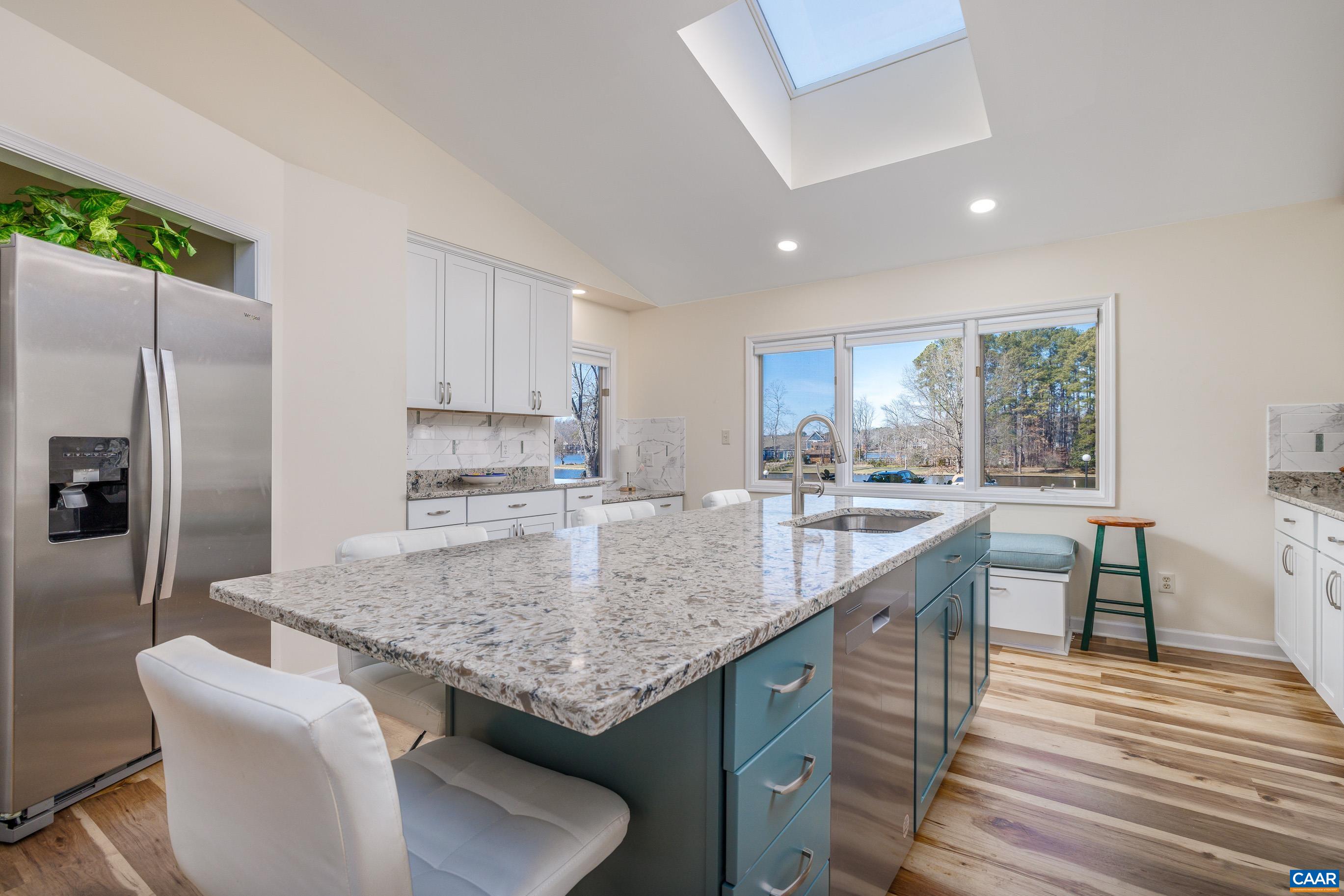B3 Marina Point Palmyra, VA 22963 - Photo 10 of 47 a kitchen with stainless steel appliances granite countertop a sink stove and refrigerator