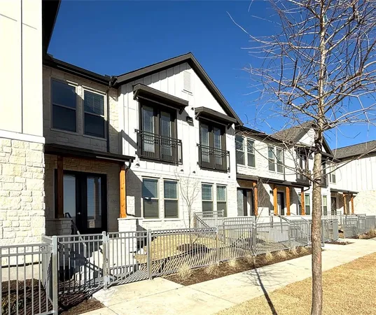 a view of a hallway with a refrigerator