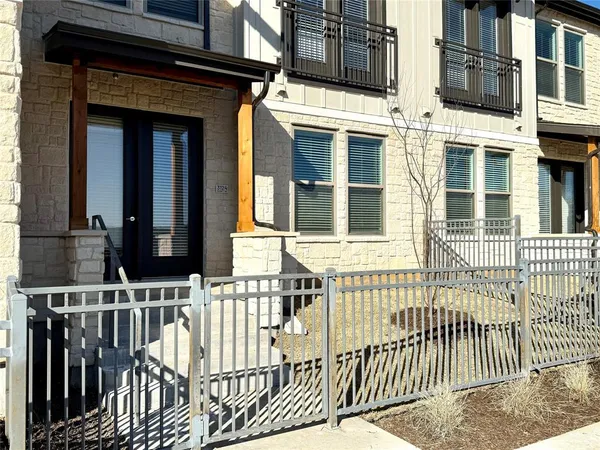 a view of a livingroom with a ceiling fan and window