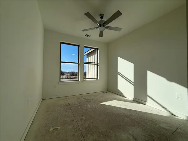 a living room with stainless steel appliances kitchen island furniture and a kitchen view
