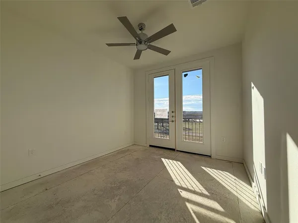 a bathroom with a granite countertop sink a mirror and a bathtub