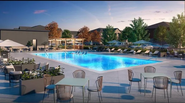 a view of a swimming pool with outdoor seating space