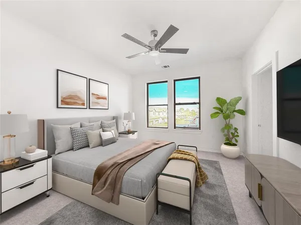 a bedroom with a bed and ceiling fan