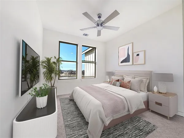 a bedroom with a large bed and a window