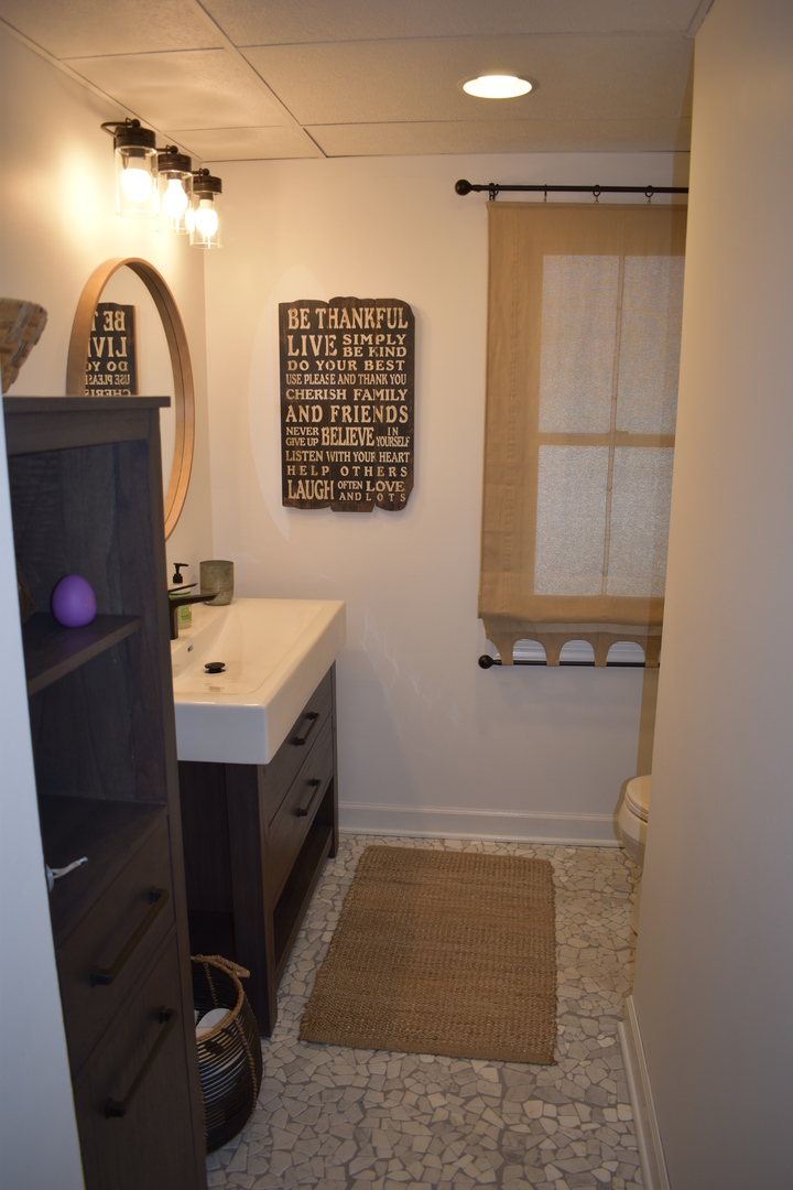 11551 Deerpath Road Sycamore, IL 60178 - Photo 22 of 50 a bathroom with a sink and a mirror