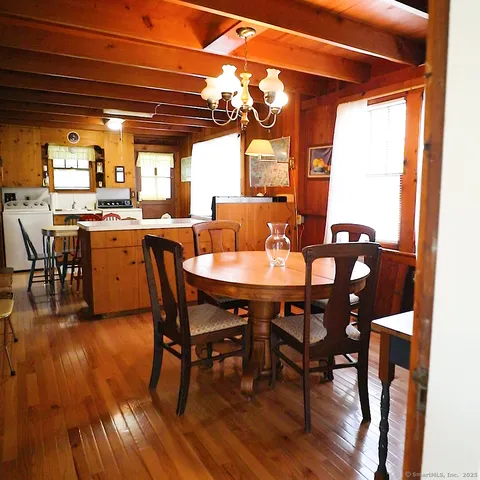 a view of a dining room with furniture and window