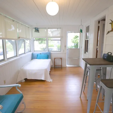 a bedroom with two beds and a large window