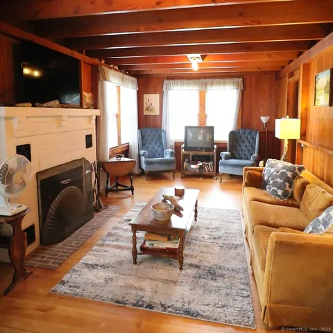 a living room with furniture and a table