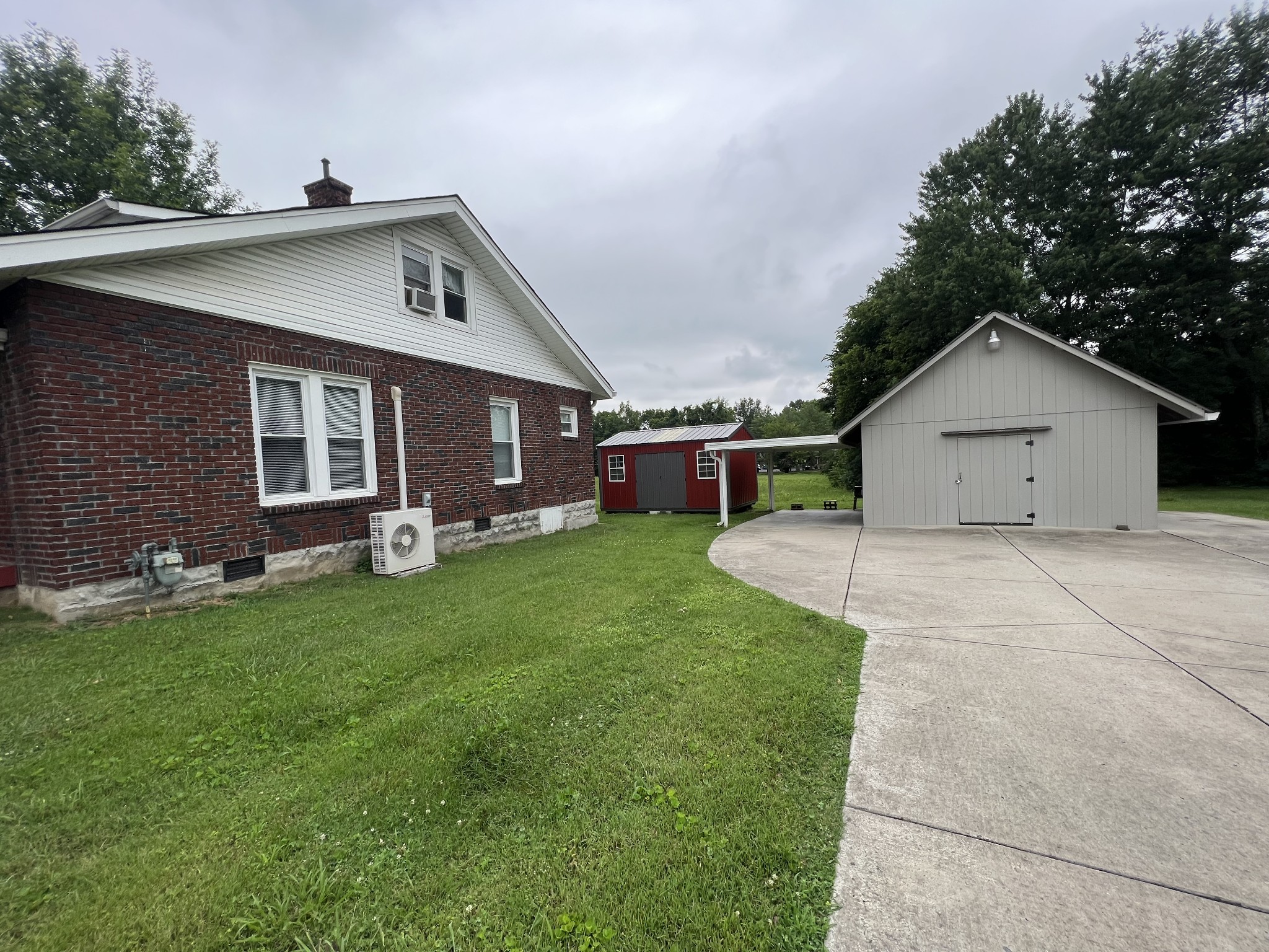 204 Portland Road White House, TN 37188 - Photo 13 of 13 a view of a house with a yard and a garage