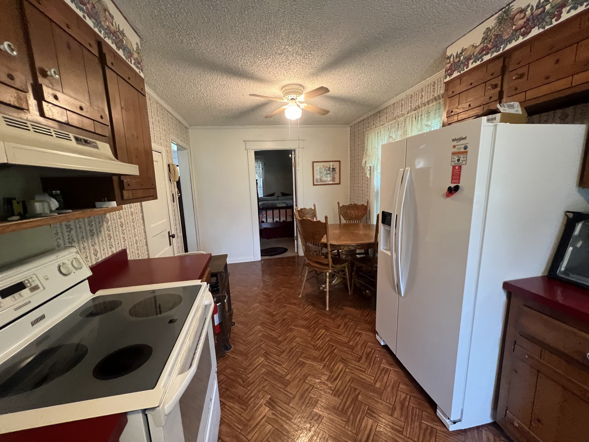 204 Portland Road White House, TN 37188 - Photo 7 of 13 a kitchen with stainless steel appliances a stove a refrigerator and a dining table