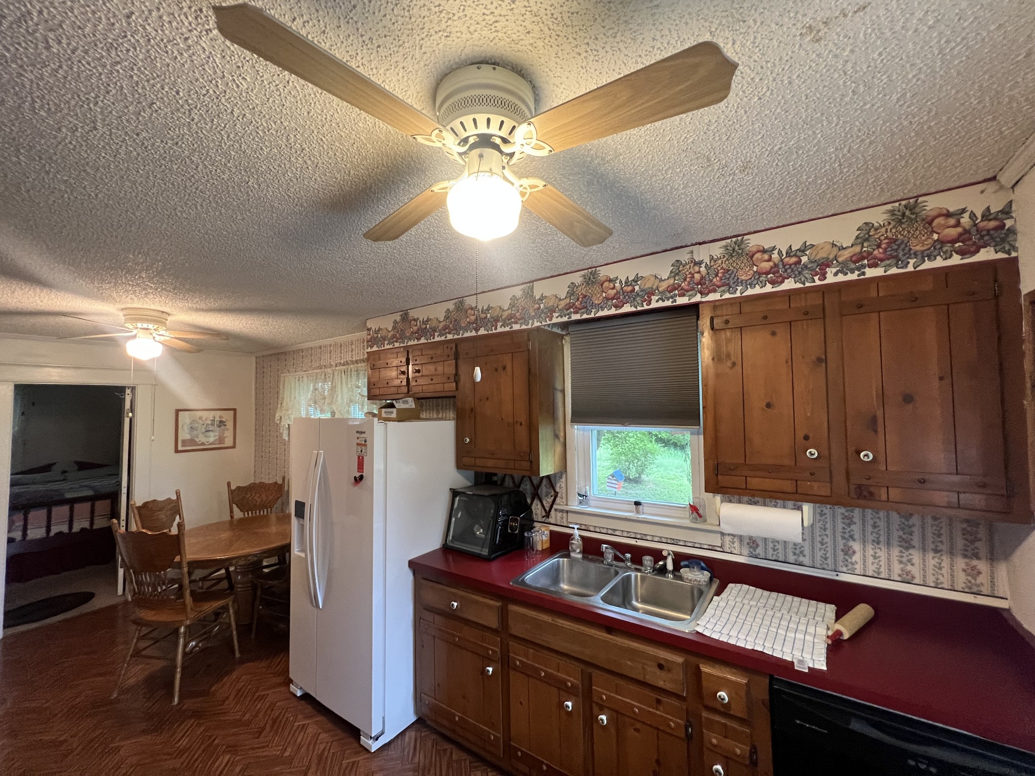 204 Portland Road White House, TN 37188 - Photo 9 of 13 a kitchen with refrigerator and window