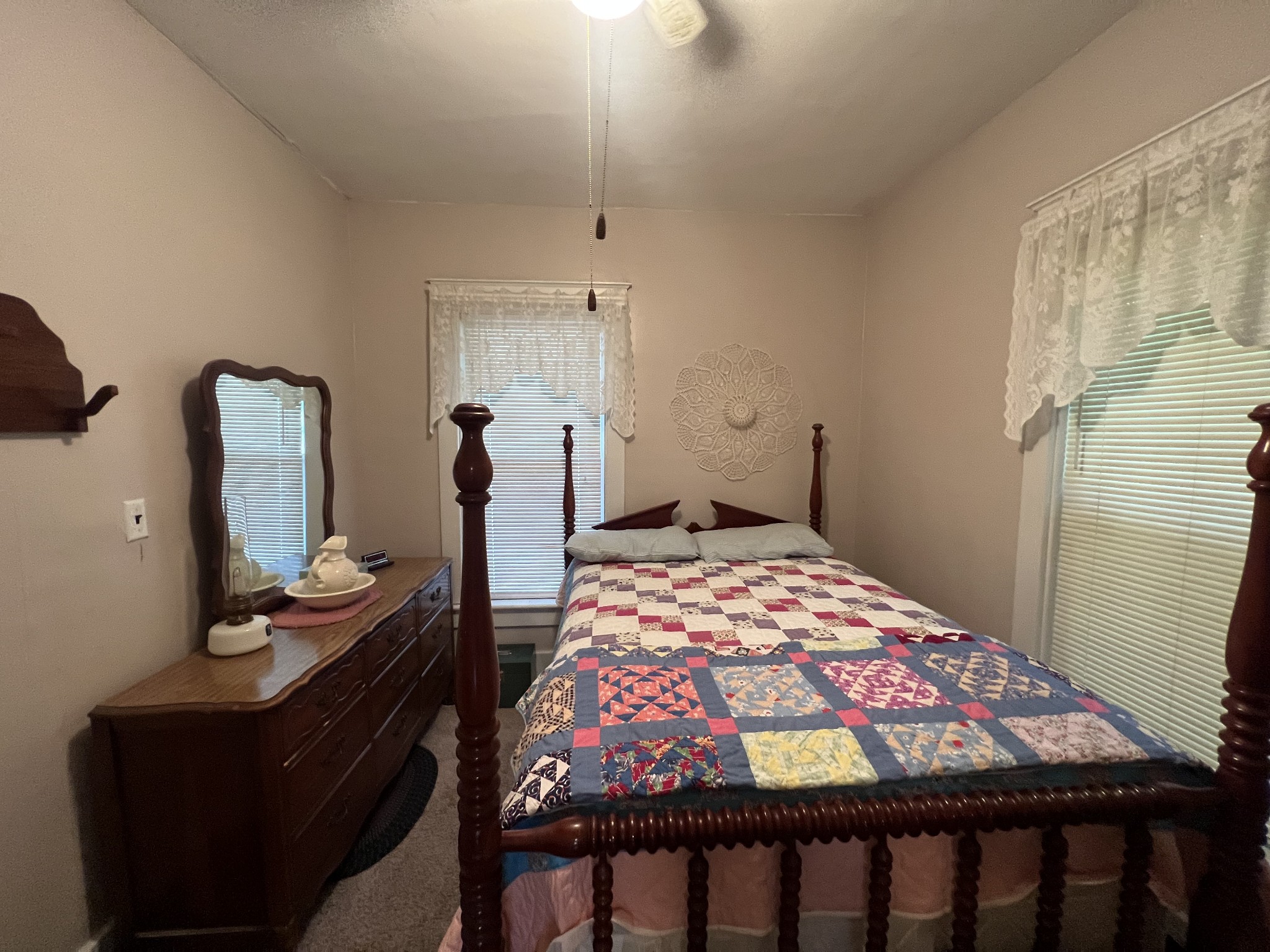 204 Portland Road White House, TN 37188 - Photo 10 of 13 a bedroom with a bed and dresser with mirror