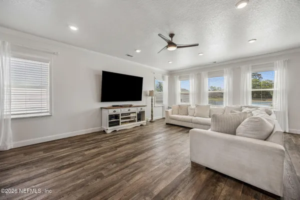 a kitchen with stainless steel appliances granite countertop a sink a stove a microwave and cabinets