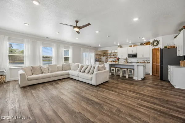 a kitchen with stainless steel appliances a sink stove and cabinets