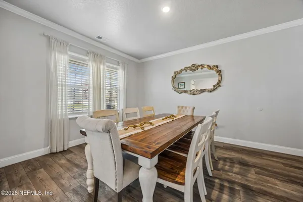 a view of walk in closet with clothes