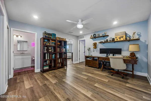 a view of a bedroom with furniture and empty room
