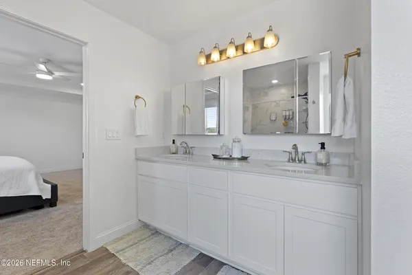 a view of a lake with houses in the back