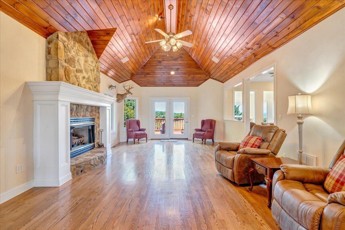 625 Frontier Way Fincastle, VA 24090 - Photo 13 of 105 a living room with furniture and a fireplace