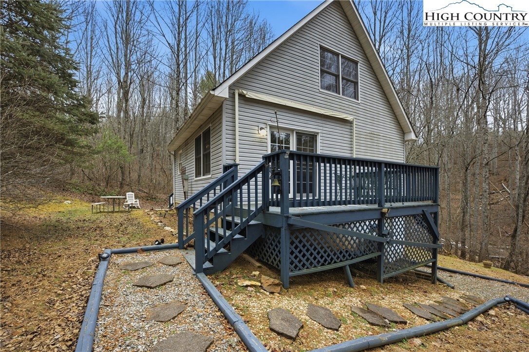 476 Moon Ridge Road Crumpler, NC 28617 - Photo 28 of 35 a view of a house with a wooden deck