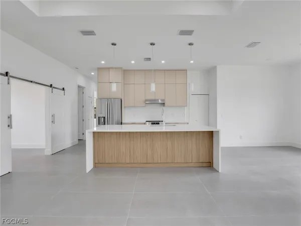 a view of kitchen with wooden floor and window