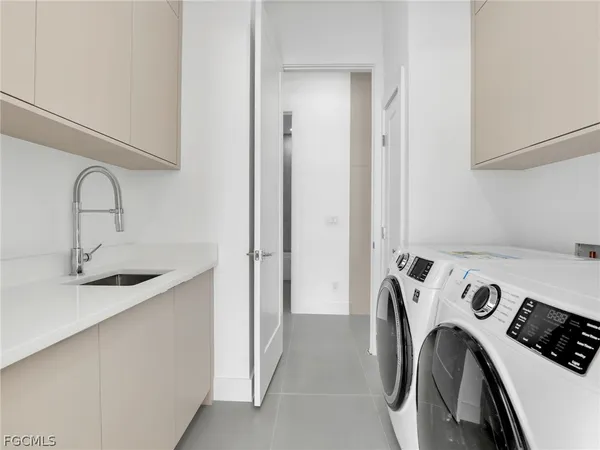 a view of storage and utility room with washer and dryer