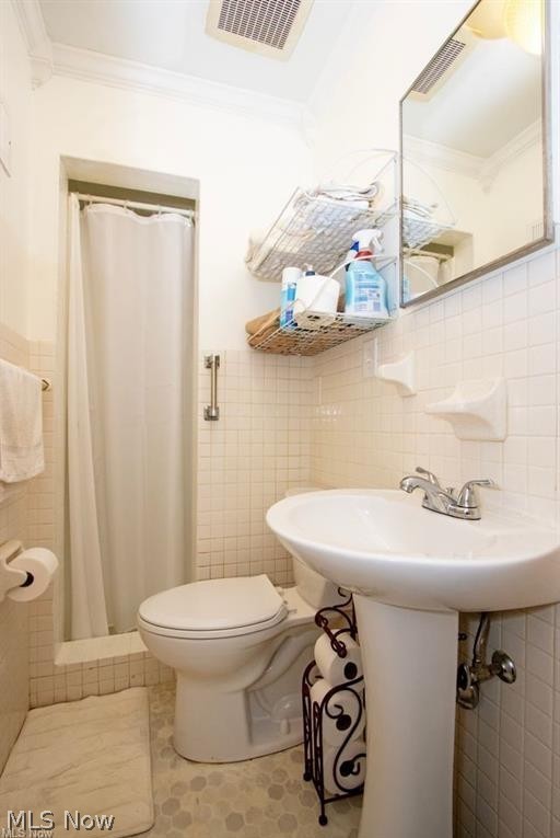 2530 Tuckahoe Road Wooster, OH 44691 - Photo 25 of 29 Bathroom featuring white ceramic wall tiles, a pedestal sink with a chrome faucet, a toilet, and a tiled shower stall