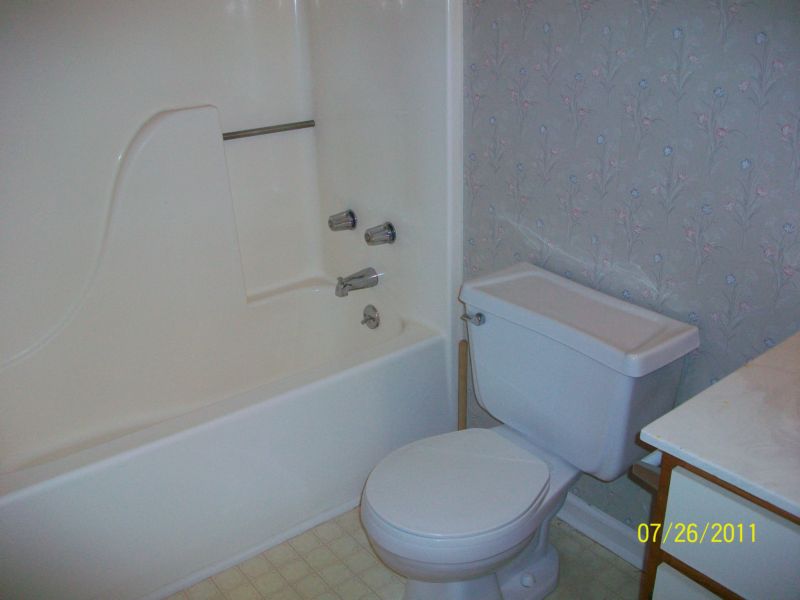 103 Calhoun Street, Unit 13 Clemson, SC 29631 - Photo 2 of 6 A well-maintained bathroom with a clean tub and toilet, ready for personal touches.