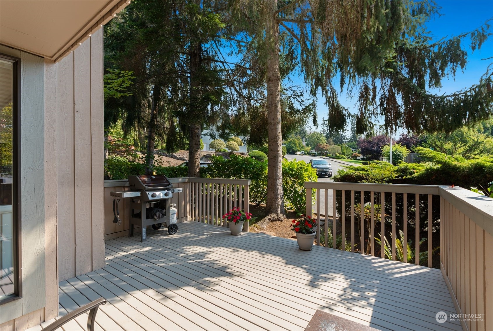 2900 Kennewick Place Northeast Renton, WA 98056 - Photo 17 of 40 a view of a balcony with wooden floor and outdoor seating