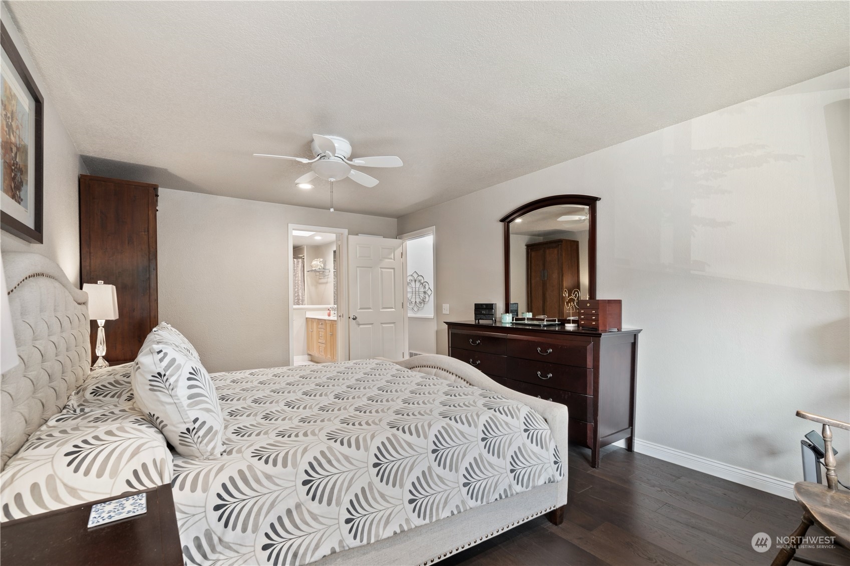 2900 Kennewick Place Northeast Renton, WA 98056 - Photo 21 of 40 a bedroom with a large bed and a chandelier