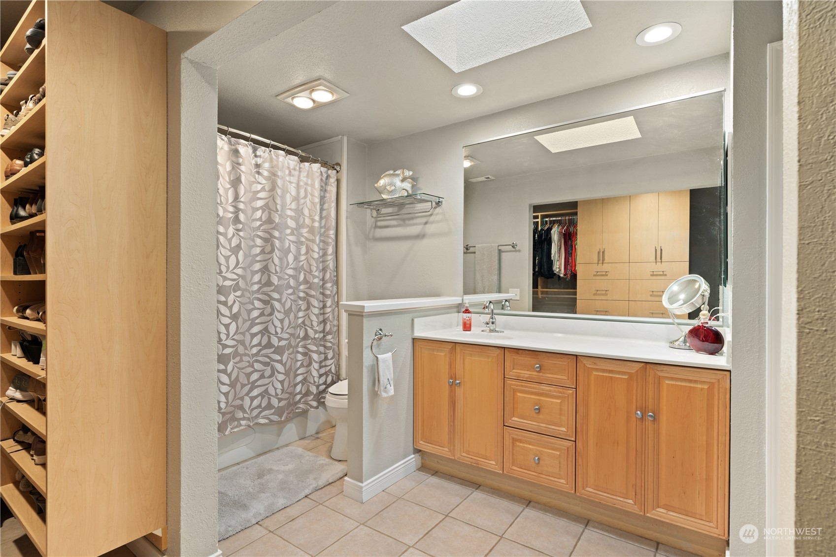 2900 Kennewick Place Northeast Renton, WA 98056 - Photo 23 of 40 a bathroom with a double vanity sink mirror and shower