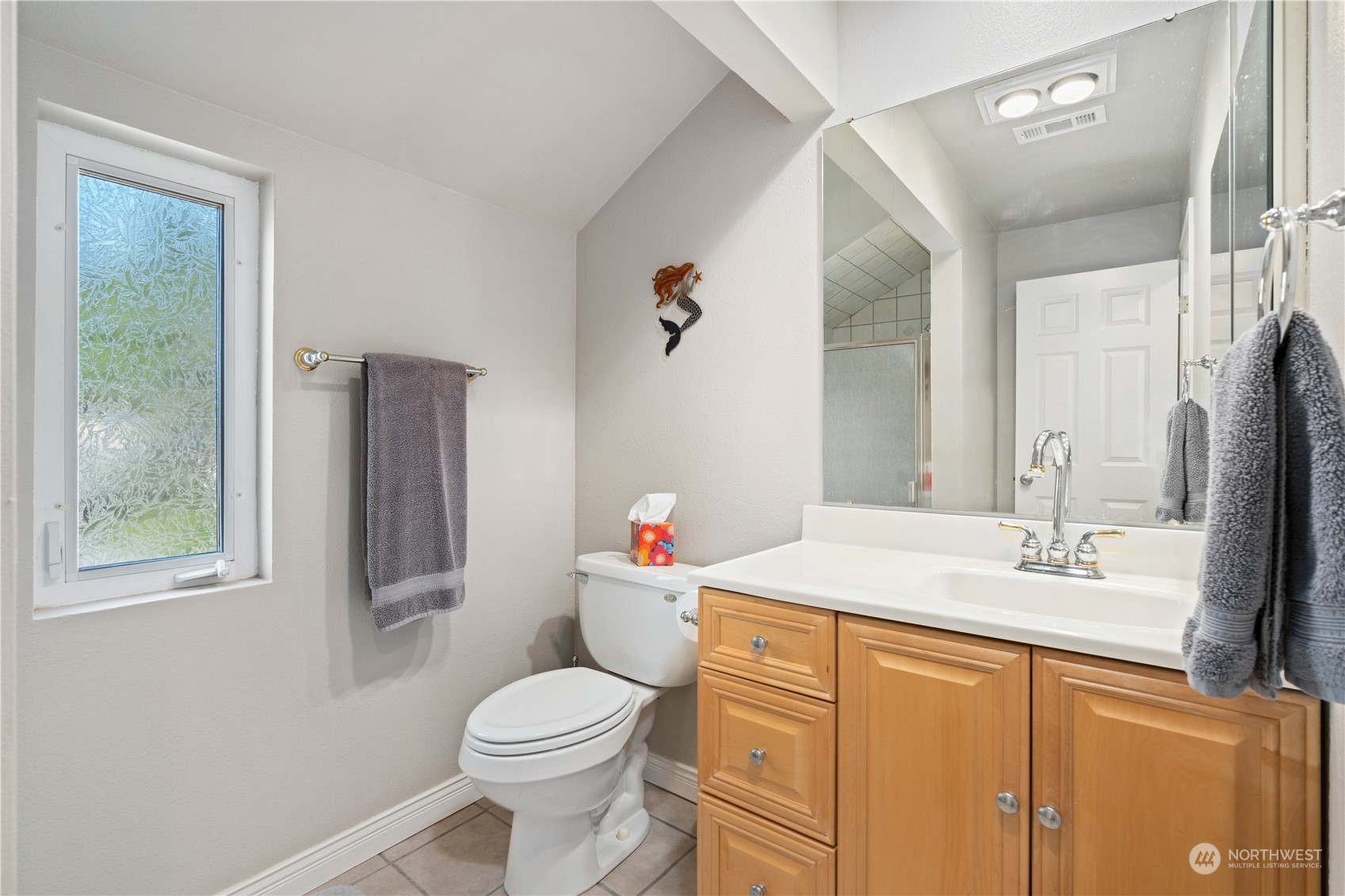 2900 Kennewick Place Northeast Renton, WA 98056 - Photo 27 of 40 a bathroom with a sink vanity mirror and toilet