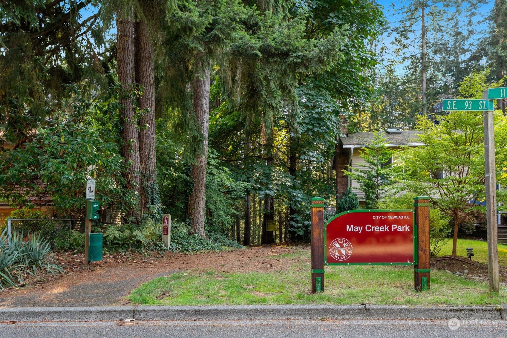2900 Kennewick Place Northeast Renton, WA 98056 - Photo 34 of 40 a sign board with tall trees