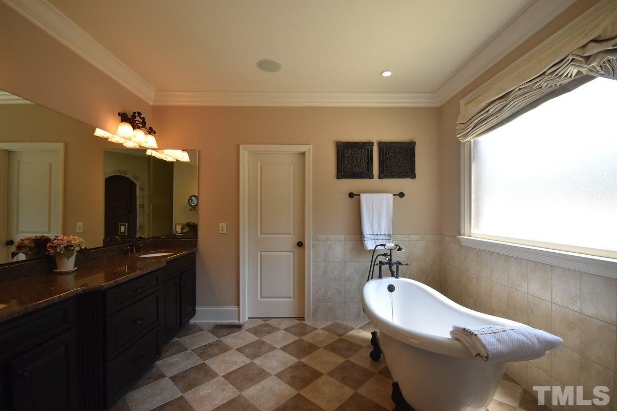 4012 Limerick Road Burlington, NC 27215 - Photo 12 of 24 a bathroom with a toilet sink and mirror