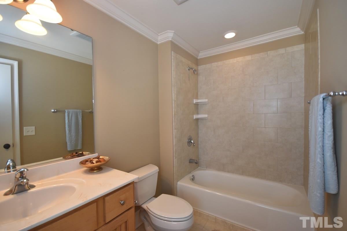 4012 Limerick Road Burlington, NC 27215 - Photo 15 of 24 a bathroom with a sink a toilet and shower