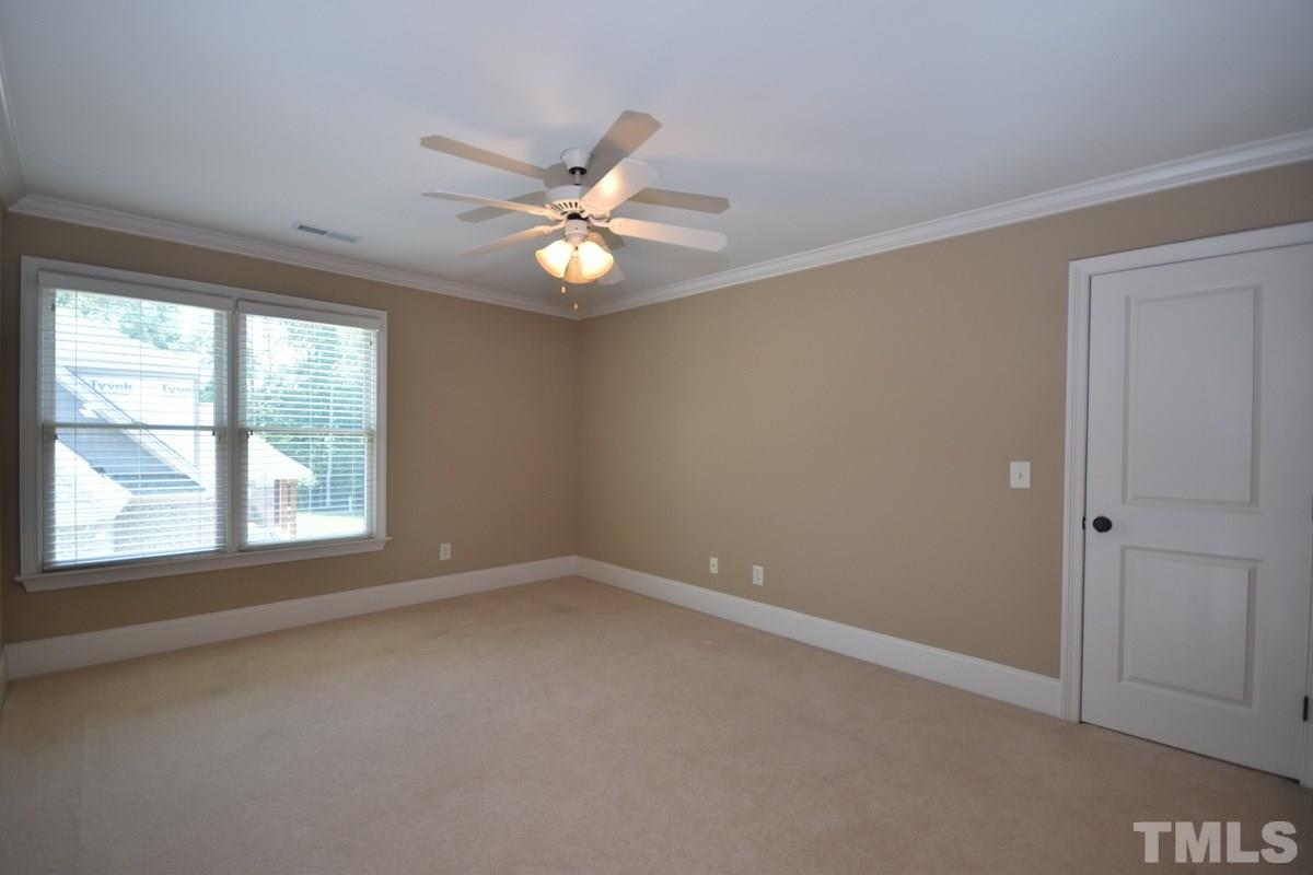 4012 Limerick Road Burlington, NC 27215 - Photo 16 of 24 an empty room with windows and fan