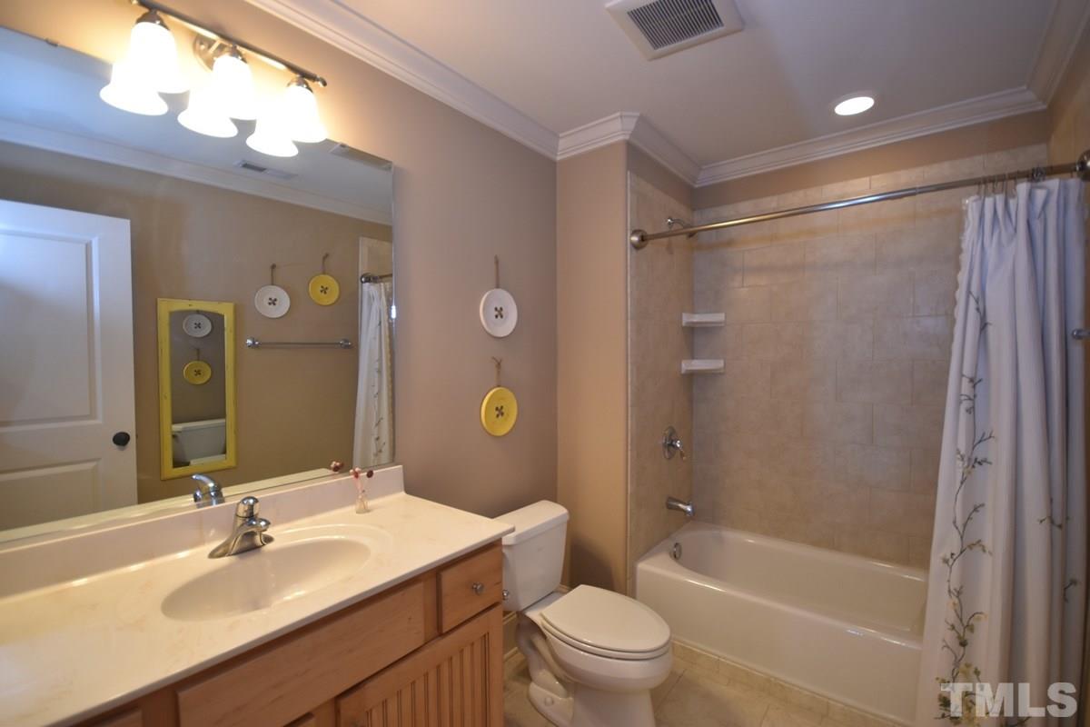 4012 Limerick Road Burlington, NC 27215 - Photo 17 of 24 a bathroom with a sink toilet tub and shower