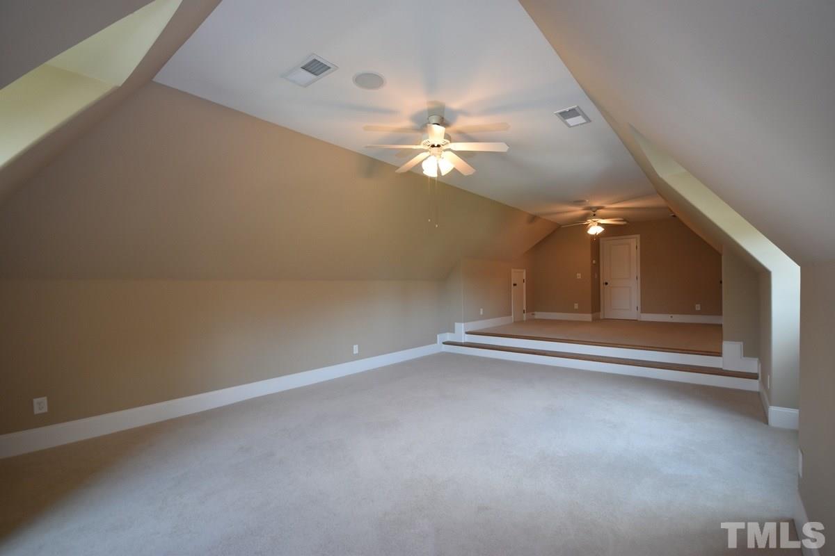 4012 Limerick Road Burlington, NC 27215 - Photo 18 of 24 en empty room with windows and fan