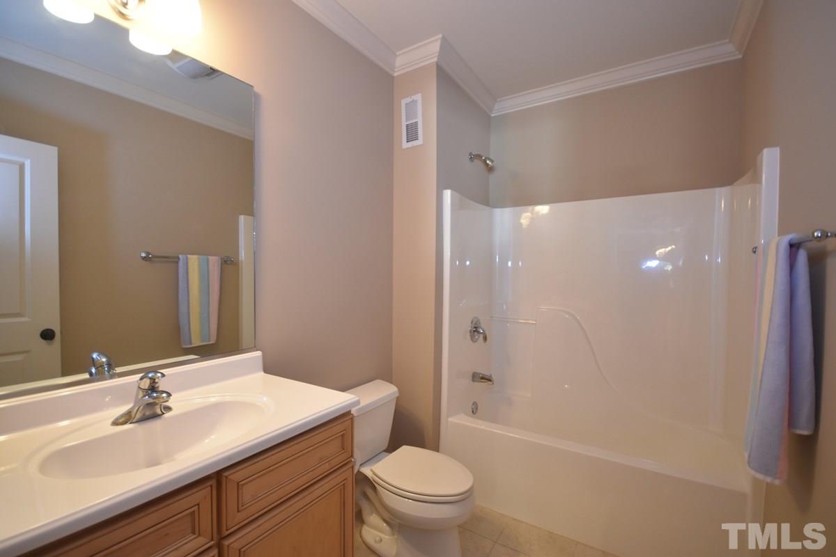 4012 Limerick Road Burlington, NC 27215 - Photo 20 of 24 a bathroom with a sink a toilet and shower